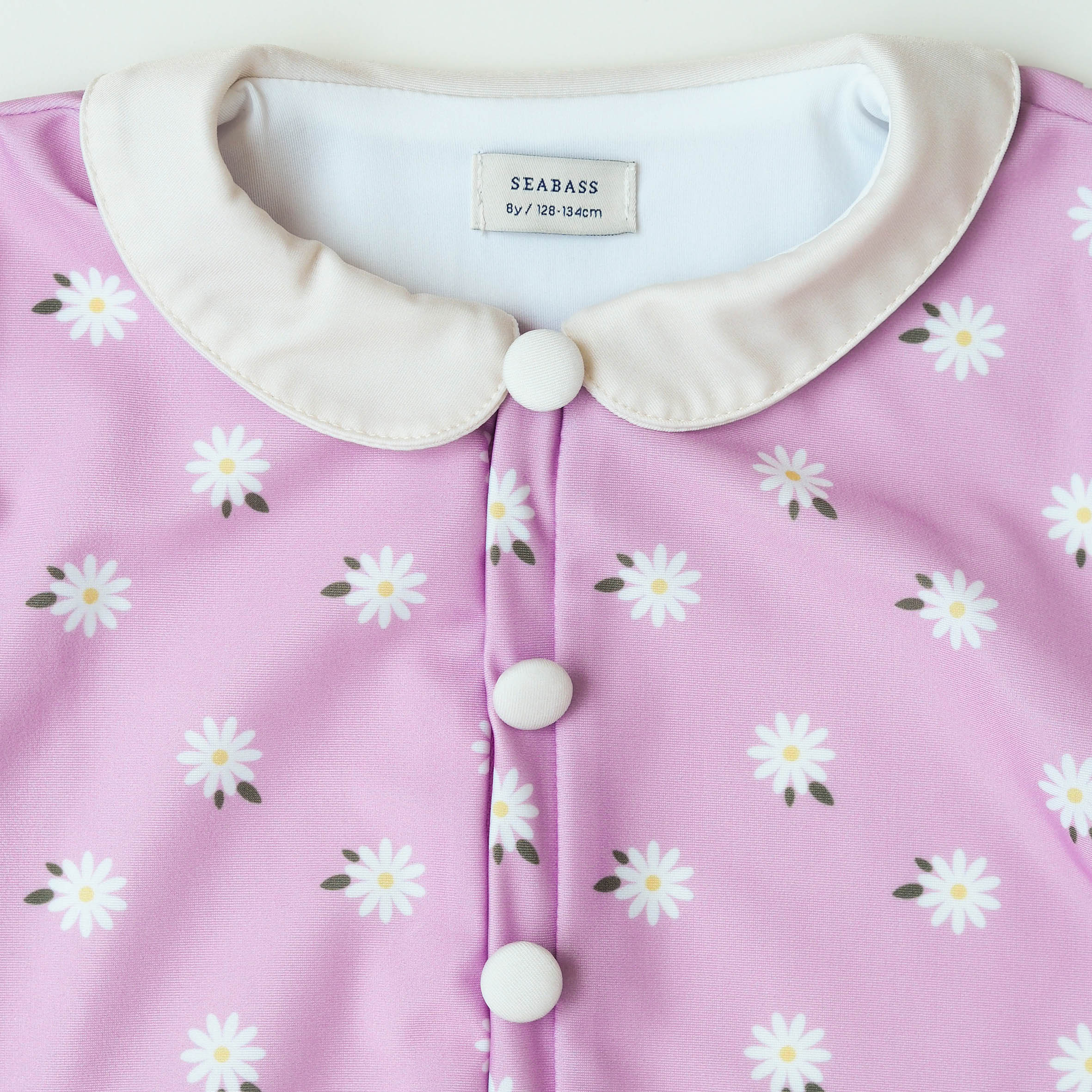 Mädchen UV Badeanzug Ruffle Florence - Lila mit Gänseblümchen